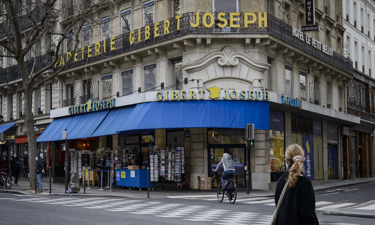 People walk past a Gibert Joseph bookstore in Paris on February 17. Photo: AFP
