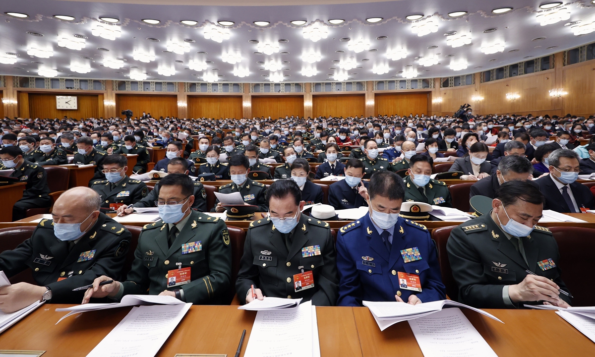 Deputies from the People's Liberation Army  delegation to the National People's Congress at the Great Hall of the People on Monday.  The two sessions are underway as scheduled, with more than 5,000 national lawmakers and political advisors gathering in Beijing. Photo: cnsphoto