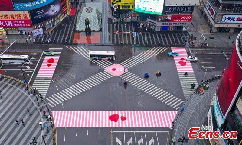 The zebra crossings at the intersection of Huangxing Road and Jiefangxi Road in Changsha City, Central China's Hunan Province, are painted pink to celebrate the International Women's Day, March 8, 2021. (Photo: China News Service/Yang Huafeng)

