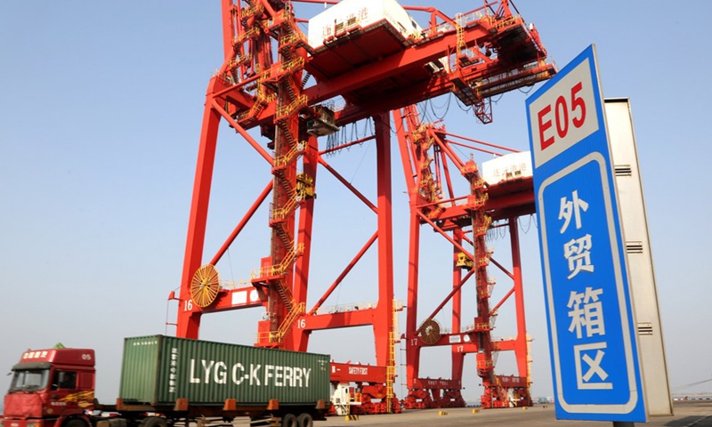 A container is transported on a truck at the container terminal of the Lianyungang Port in Lianyungang City, east China's Jiangsu Province, Jan. 14, 2021.(Photo: Xinhua)