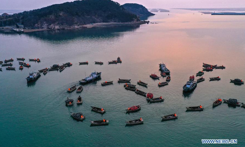 Aerial photo shows fishermen preparing to row boats to the mariculture zone as local aquatic products enter the growing season in Lidao Township, Rongcheng City, east China's Shandong Province, March 9, 2021.Photo:Xinhua