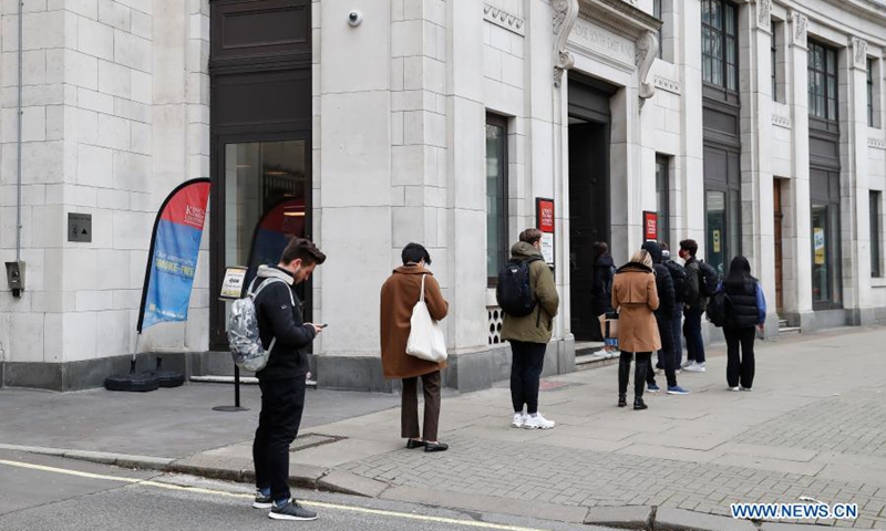 Students queue at an entrance to King's College in London, Britain, on March 8, 2021. Amid a mixed sense of nervousness and excitement, millions of children returned to schools across England on Monday under phase one of the British government's roadmap to recovery from the COVID-19 pandemic.(Photo: Xinhua)