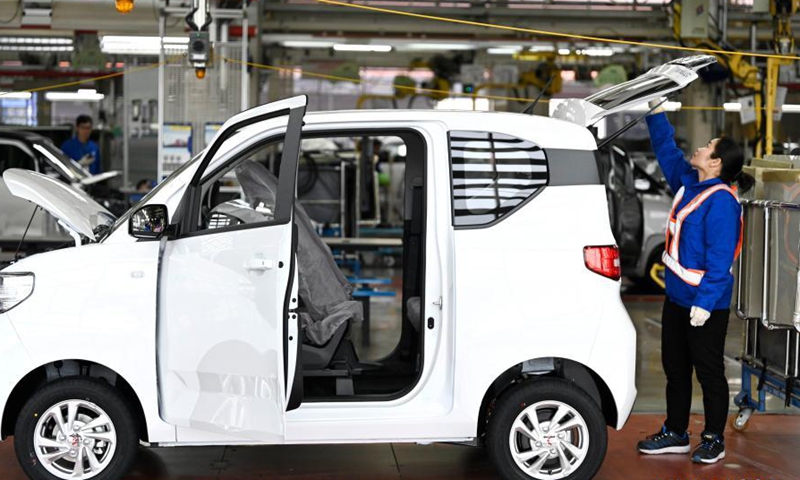 An employee works at a production line of new energy vehicles in Liuzhou, south China's Guangxi Zhuang Autonomous Region, March 8, 2021. Liuzhou is a famous automobile industrial base. In recent years, local new energy automobile industry has seen vigorous development.Photo:Xinhua