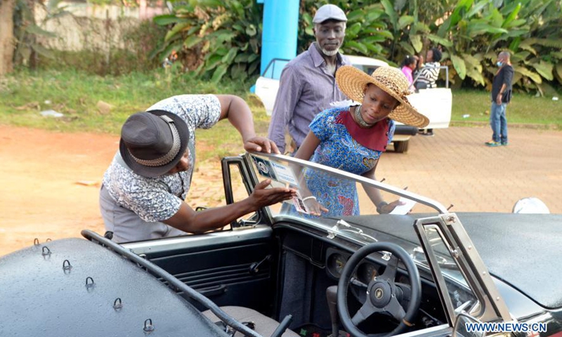 People view an automobile on display at a show in Kampala, Uganda, March 8, 2021. A show featuring over 40 vintage and classic automobiles was held in Kampala.Photo:Xinhua