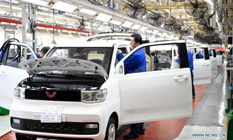 An employee works at a production line of new energy vehicles in Liuzhou, south China's Guangxi Zhuang Autonomous Region, March 8, 2021. Liuzhou is a famous automobile industrial base. In recent years, local new energy automobile industry has seen vigorous development.Photo:Xinhua