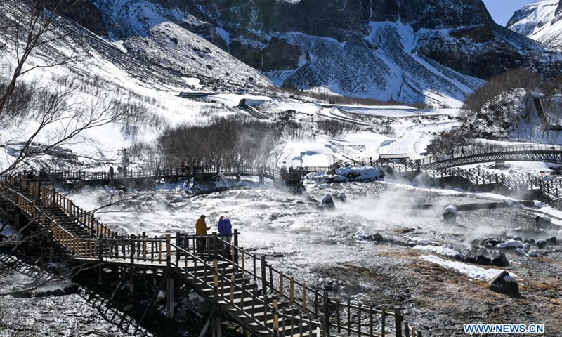 People visit snow-covered Changbai Mountain in northeast China's Jilin Province, March 7, 2021.(Photo: Xinhua)