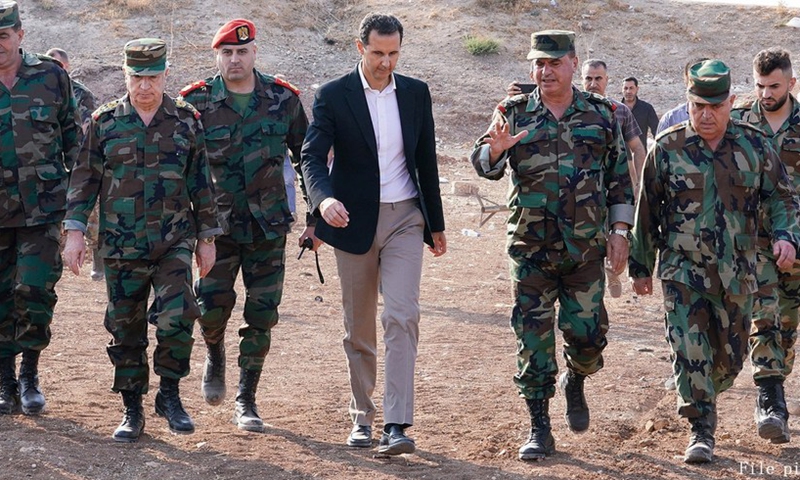 Syrian President Bashar al-Assad meets Syrian soldiers in a military base in the town of Habit in the countryside of Idlib province in northwestern Syria on Oct. 22, 2019.(Photo: Xinhua)