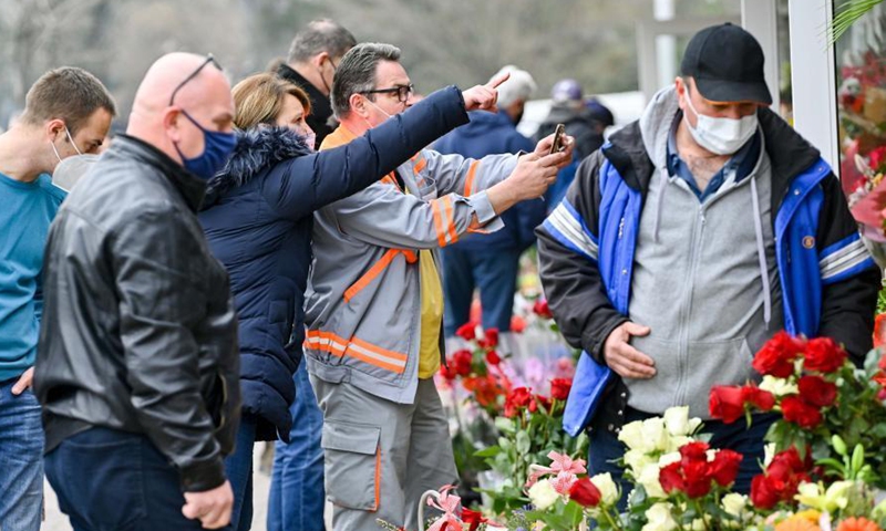 People buy flowers at a flower market on International Women's Day in Skopje, North Macedonia, on March 8, 2021.Photo:Xinhua