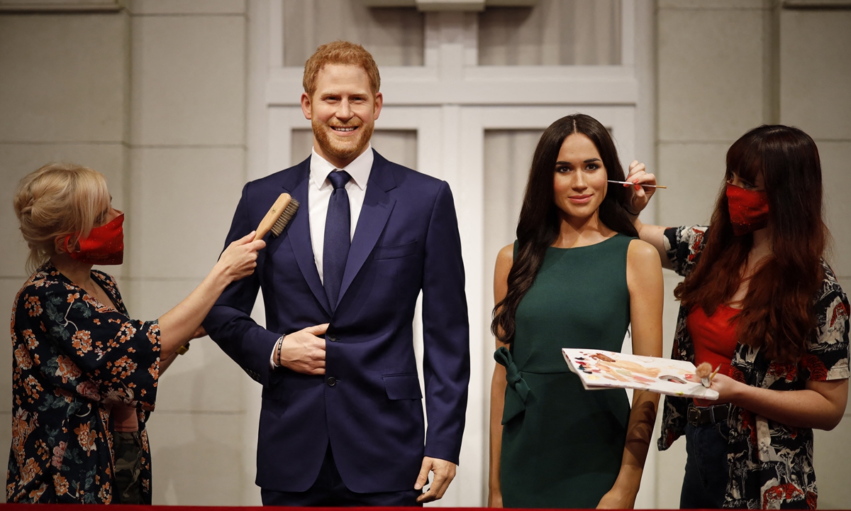 Artists put the finishing touches to wax figures of Britain’s Prince Harry (left) and Meghan on July 30, 2020 in England. Photo: AFP