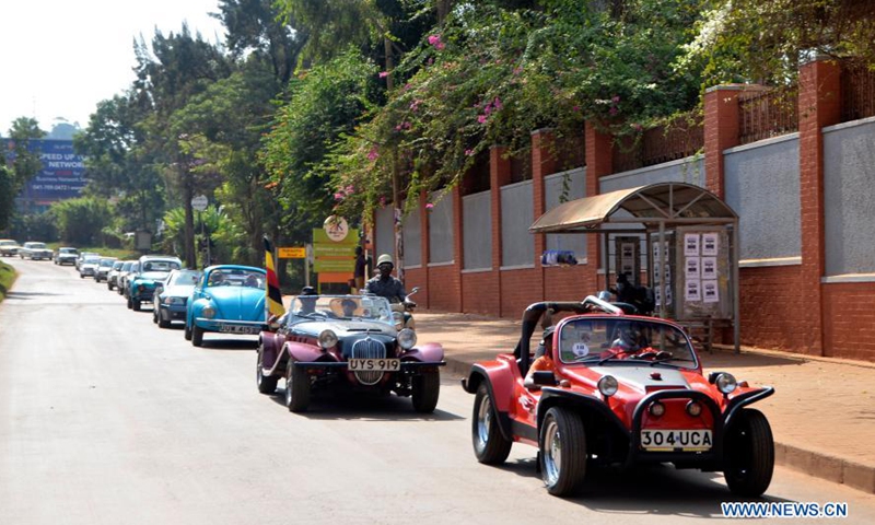 People drive automobiles in Kampala, Uganda, March 8, 2021. A show featuring over 40 vintage and classic automobiles was held in Kampala.Photo:Xinhua