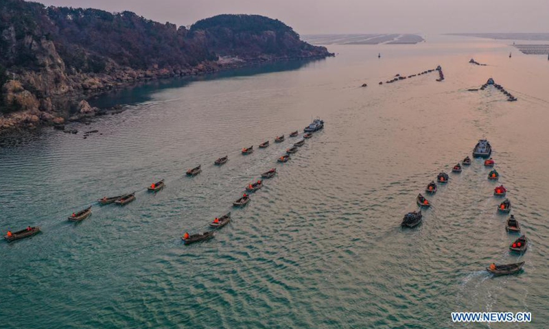 Aerial photo shows fishermen rowing boats to the mariculture zone as local aquatic products enter the maintenance period in Lidao Township, Rongcheng City, east China's Shandong Province, March 9, 2021.Photo:Xinhua