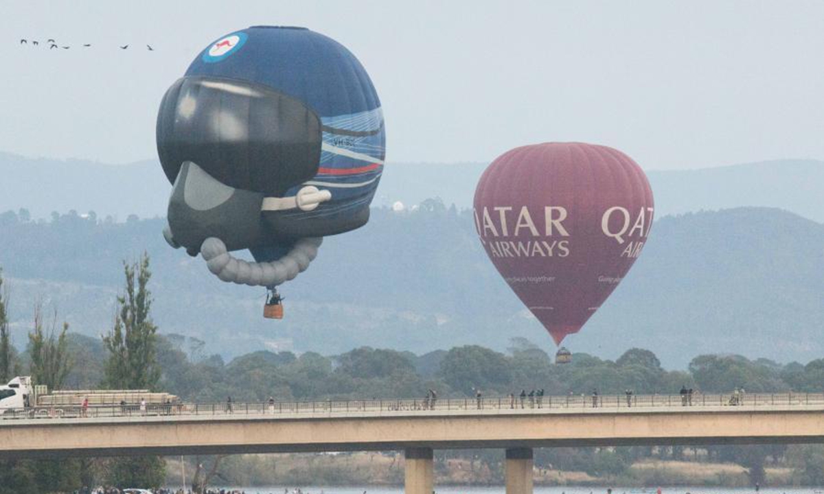 Hot air balloons are seen in the sky during the annual Canberra Balloon Spectacular festival in Canberra, Australia, March 8, 2021. The annual Canberra Balloon Spectacular festival, a hot air balloon festival celebrated in Australia's capital city, is held this year from March 6 to 14. (Photo by Liu Changchang/Xinhua)