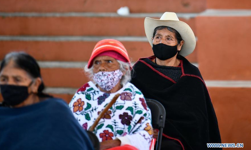 Elder people wait to receive COVID-19 vaccine developed by Chinese pharmaceutical company Sinovac at an inoculation site in Acaxochitlan, State of Hidalgo, Mexico, March 9, 2021.Photo:Xinhua