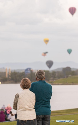 Hot air balloons are seen in the sky during the annual Canberra Balloon Spectacular festival in Canberra, Australia, March 8, 2021. The annual Canberra Balloon Spectacular festival, a hot air balloon festival celebrated in Australia's capital city, is held this year from March 6 to 14. (Photo by Liu Changchang/Xinhua)