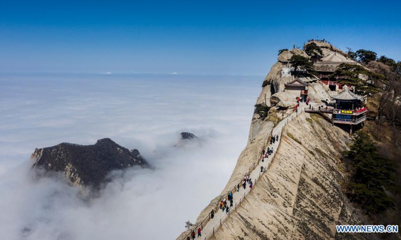 Aerial photo taken on March 9, 2021 shows people visiting Mount Huashan in northwest China's Shaanxi Province. (Photo: Xinhua)