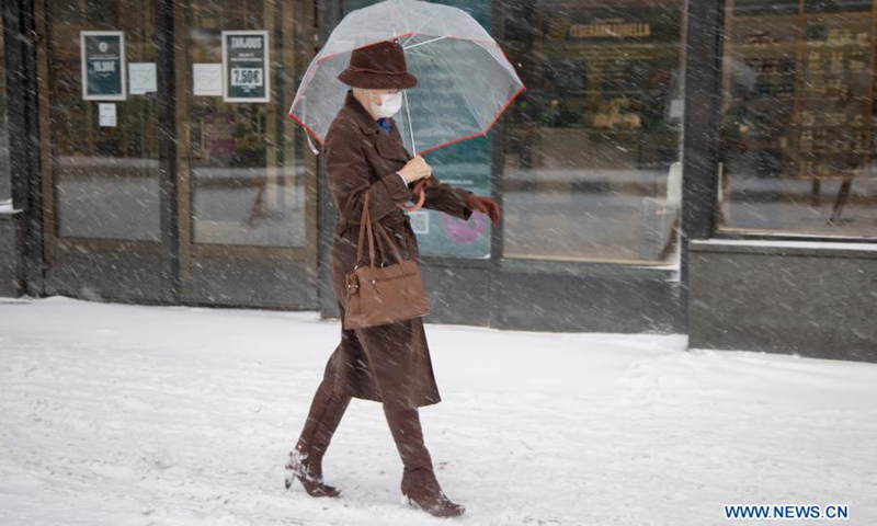 A pedestrian walks in heavy snow in Helsinki, Finland, on March 9, 2021.(Photo: Xinhua)