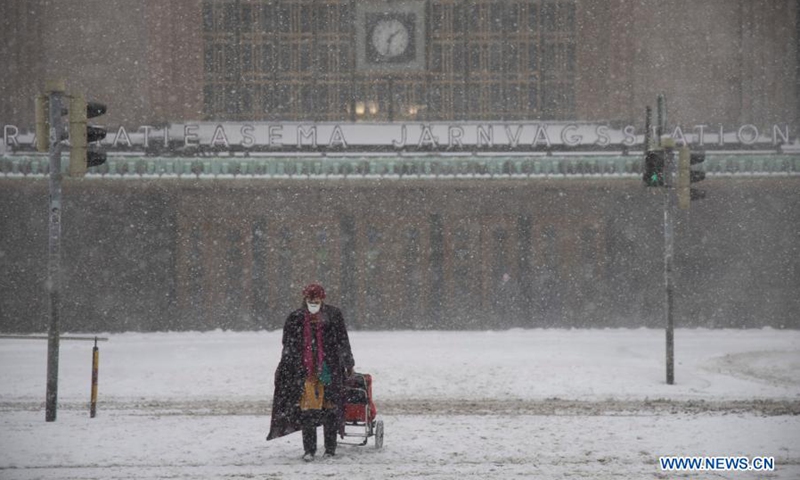 A pedestrian walks in heavy snow in Helsinki, Finland, on March 9, 2021.(Photo: Xinhua)