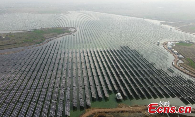 Aerial photo taken on March 9, 2021, shows the photovoltaic power generation project of fish and light complementary under construction in Anhui.Photo:China News Service