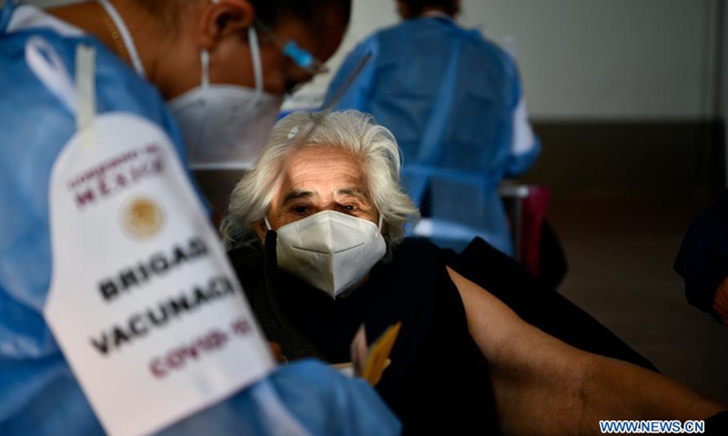 An elder woman prepares to receive COVID-19 vaccine developed by Chinese pharmaceutical company Sinovac at an inoculation site in Acaxochitlan, State of Hidalgo, Mexico, March 9, 2021.Photo:Xinhua