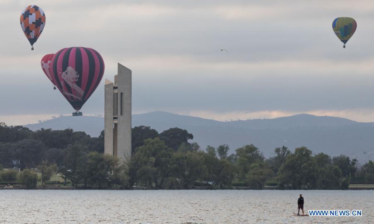 Hot air balloons are seen in the sky during the annual Canberra Balloon Spectacular festival in Canberra, Australia, March 8, 2021. The annual Canberra Balloon Spectacular festival, a hot air balloon festival celebrated in Australia's capital city, is held this year from March 6 to 14. (Photo by Liu Changchang/Xinhua)