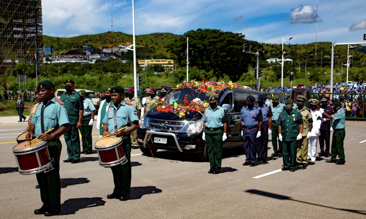 Military officers escort the hearse carrying the coffin of the former Papua New Guinea's prime minister Michael Somare during his funeral ceremony at Parliament House in Port Moresby on Thursday. Photo: AFP