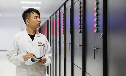 A staff inspects Chinese supercomputer Sunway TaihuLight at a center in Wuxi, East China's Jiangsu Province. Photo: IC 