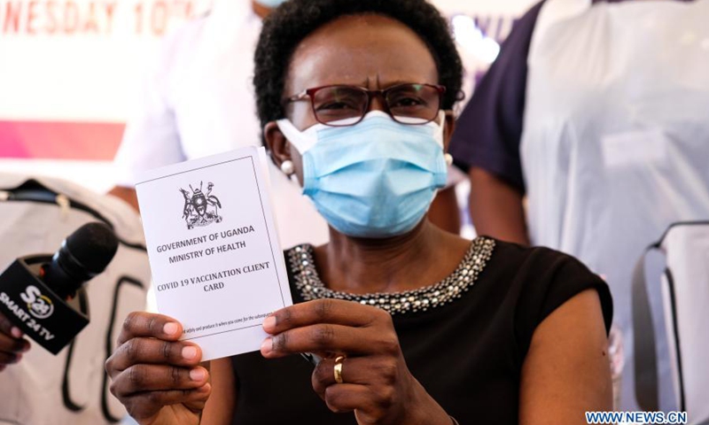 Uganda's Minister of Health Jane Ruth Aceng shows her vaccination card after receiving a shot of COVID-19 vaccine during the launch of the vaccination campaign at Mulago Specialized Women and Neonatal Hospital in Kampala, Uganda, March 10, 2021. Uganda on Wednesday launched the first phase of COVID-19 vaccination campaign targeting high risk groups in the east African country.(Photo: Xinhua)