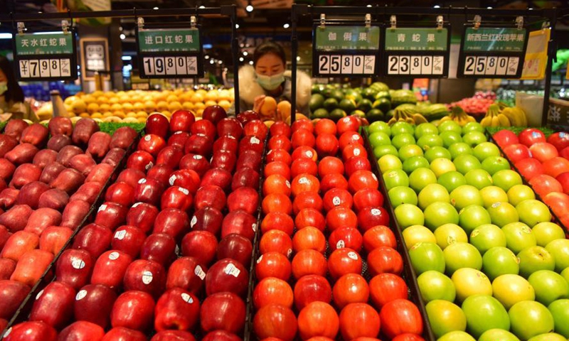 People select food at a supermarket in Danzhai County of Qiandongnan Miao and Dong Autonomous Prefecture, southwest China's Guizhou Province, March 10, 2021.Photo:Xinhua
