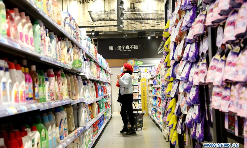 People select products at a supermarket in Lianyungang City, east China's Jiangsu Province, March 10, 2021.Photo:Xinhua