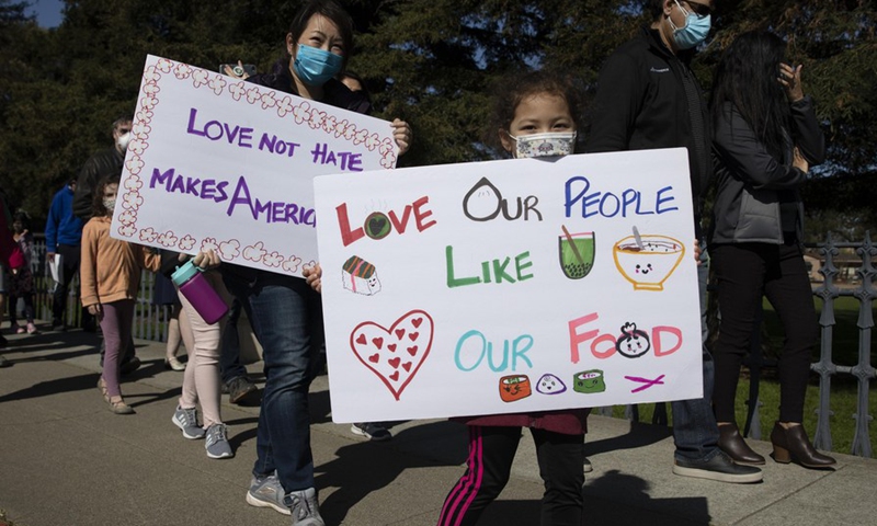 People take part in a rally against anti-Asian hate crimes in San Mateo, California, the United States, Feb. 27, 2021.(Photo: Xinhua)