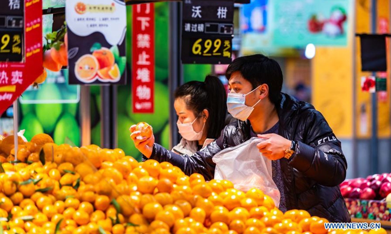 People select food at a supermarket in Xixiu District of Anshun, southwest China's Guizhou Province, March 10, 2021.Photo:Xinhua
