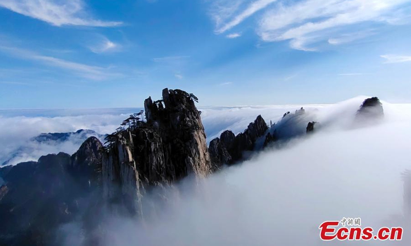 A beautiful sea of clouds occurs after a rainfall at the Huangshan Mountain scenic area in Anhui on March 10. The morning sun warmed the sea of clouds to a radiant glow.Photo:China News Service