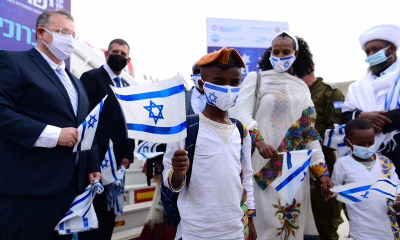 Ethiopian Jewish immigrants making their Aliyah (Immigration to Israel) arrive at Ben Gurion International Airport near central Israeli city of Tel Aviv amid the COVID-19 pandemic on March 11, 2021.(Photo:Xinhua) 