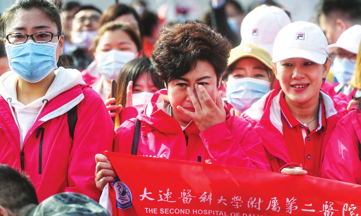 At the reopening of Leishenshan Hospital on Sunday, a medical worker from the Second Hospital of Dalian Medical University from Liaoning Province, burst into tears when looking at the place where they had combat the epidemic.
