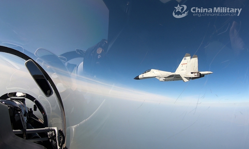 Fighter jets attached to a base under the PLA Naval Aviation University soar in the sky during a round-the-clock flight training exercise in late February, 2021.(Photo: eng.chinamil.com.cn)