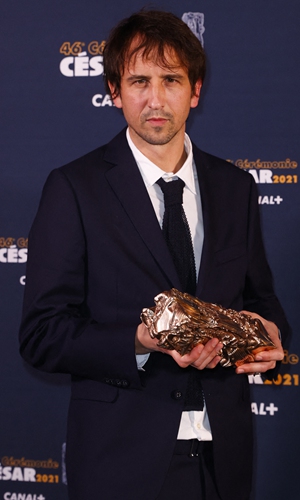 Stephane Demoustier poses with the Cesar award for best adapted screenplay on Friday. Photo: AFP