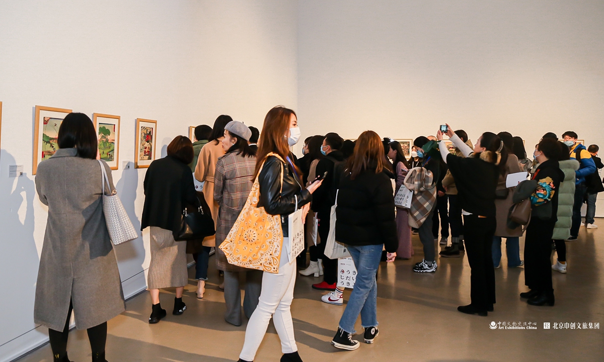 Visitors take photos of <em>The Meeting Ukiyo-e: a Floating World of Edo City</em> exhibition in Beijing on Friday. Photo: Courtesy of Chang Jing 