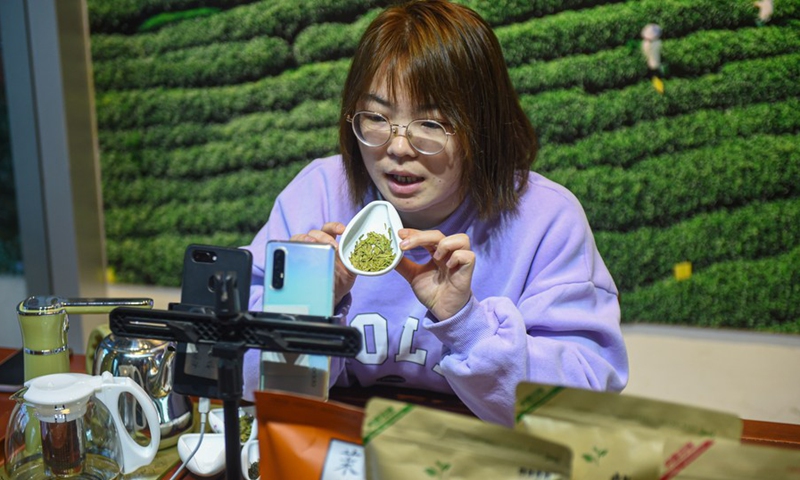 Ye Yuzhu introduces tea to the audience via livestreaming at the tea market in Songyang County of Lishui City, east China's Zhejiang Province, Feb. 25, 2021.(Photo: Xinhua)