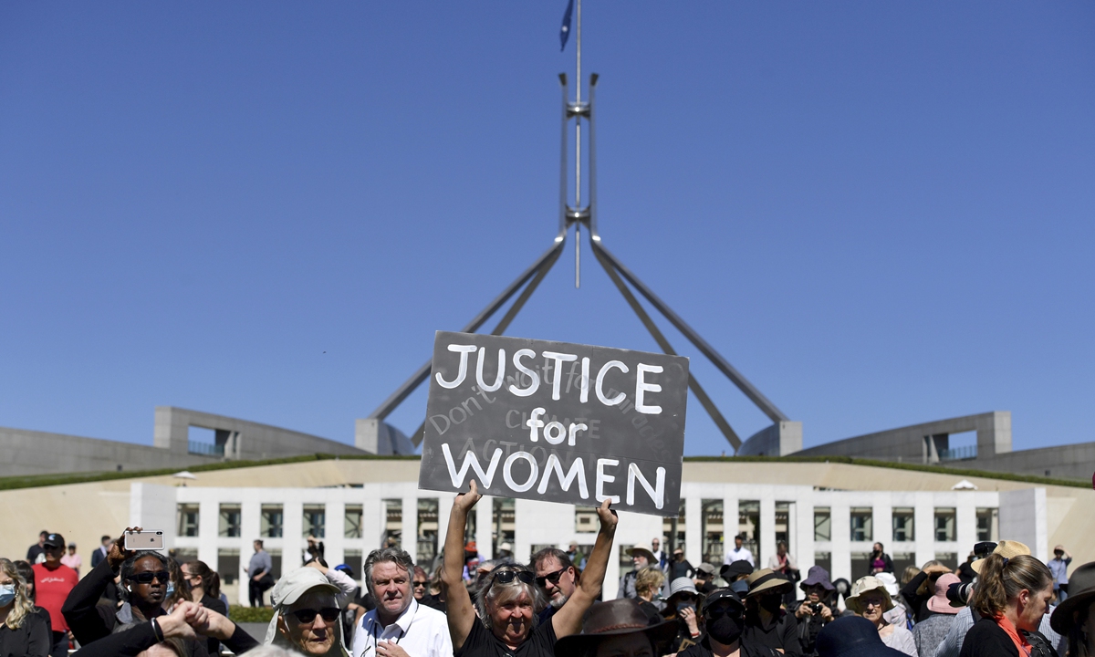 A protesters holds a placard during the Women's March 4 Justice in Canberra, Australia, Monday, March 15, 2021. The rally was one of several across Australia including in Sydney, Melbourne, Brisbane and Hobart calling out sexism, misogyny and dangerous workplace cultures. Photo: VCG