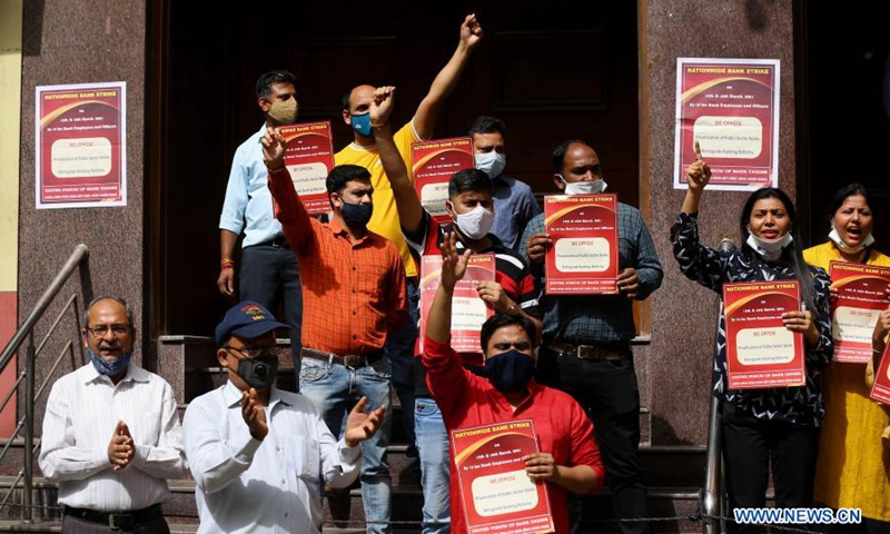 Bank employees protest against proposed privatization of two public sector banks in New Delhi, India on March 15, 2021. Banking services across India were hit Monday in the wake of a countrywide two-day strike against the proposed privatization of two public sector banks and retrograde banking reforms, officials said. According to United Forum of Bank Union (UFBU), an umbrella body of nine bank unions in India, over a million bank employees and officers participate in the strike.(Photo: Xinhua)