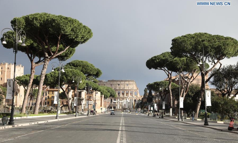 Few people walk on Via dei Fori Imperiali in Rome, Italy, March 15, 2021. Italy entered into a new period of semi-lockdown on Monday, with over half of its 20 regions falling into the red zone and subject to the maximum level of restrictions. (Photo: Xinhua)