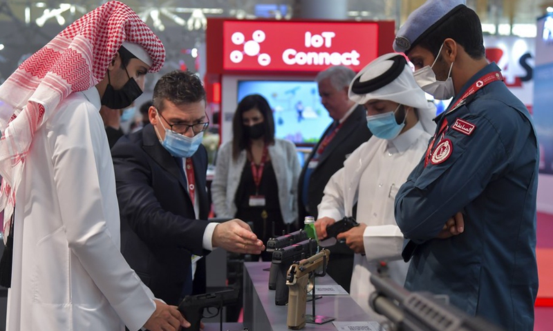 Visitors look at the exhibits at Milipol Qatar 2021, an international event for homeland security and civil defense, in Doha, Qatar, on March 15, 2021.(Photo: Xinhua)