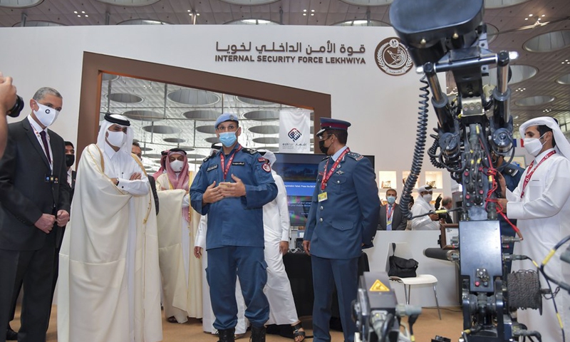 Sheikh Khalid bin Khalifa bin Abdulaziz Al Thani (2nd L, Front), Qatari prime minister and interior minister, visits a stand after the opening ceremony of Milipol Qatar 2021 in Doha, Qatar, on March 15, 2021.(Photo: Xinhua)
