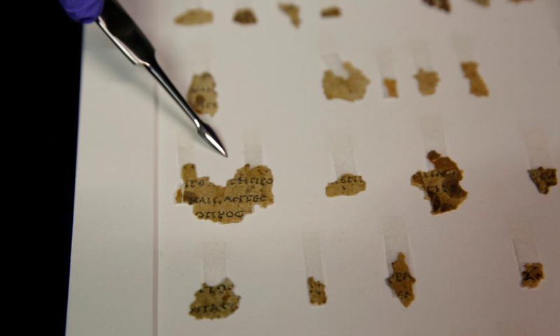 Fragments of the new discovered Dead Sea Scroll are seen in a lab in the Israel Museum in Jerusalem on March 16, 2021. Israeli archaeologists have discovered dozens of fragments of a biblical scroll written in Greek in the Cave of Horror near the Dead Sea.Photo:Xinhua