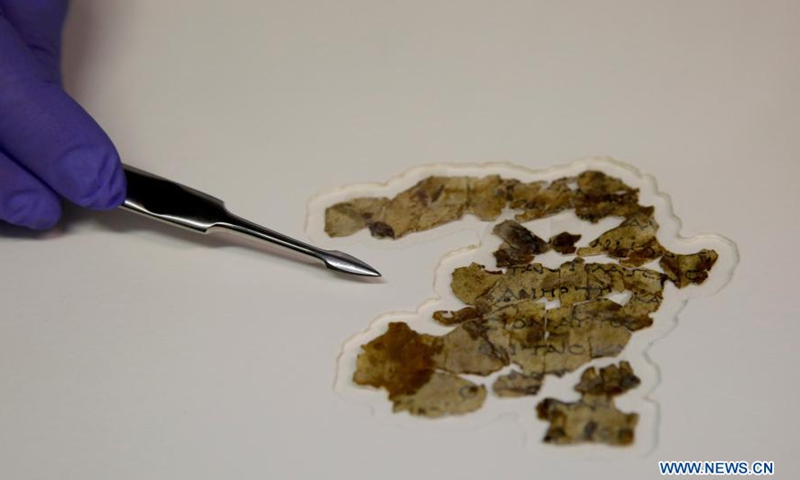 Fragments of the new discovered Dead Sea Scroll are seen in a lab in the Israel Museum in Jerusalem on March 16, 2021. Israeli archaeologists have discovered dozens of fragments of a biblical scroll written in Greek in the Cave of Horror near the Dead Sea.Photo:Xinhua