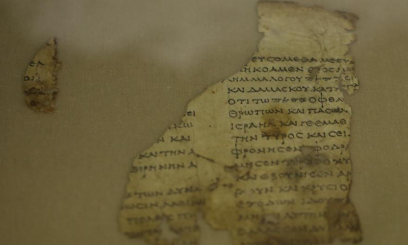 Fragments of the new discovered Dead Sea Scroll are seen in a lab in the Israel Museum in Jerusalem on March 16, 2021. Israeli archaeologists have discovered dozens of fragments of a biblical scroll written in Greek in the Cave of Horror near the Dead Sea.Photo:Xinhua