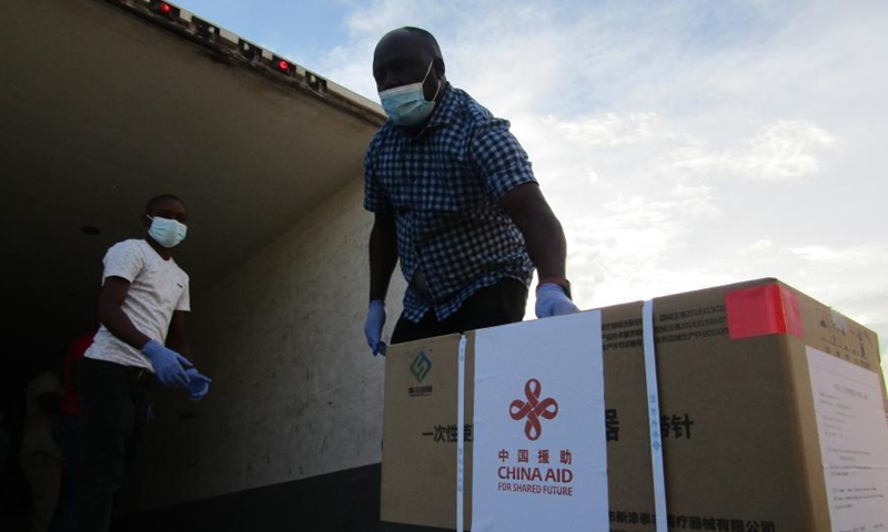 A box containing China-donated vaccines is loaded onto a truck at the Hosea Kutako International Airport in Namibia's capital Windhoek on March 16, 2021.Photo:Xinhua