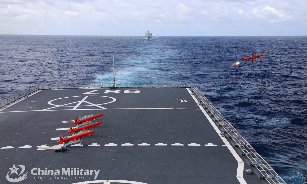 Several target aircraft take off successively from the amphibious dock landing ship Wuzhishan (Hull 987) during the actual combat training in late February, 2021. The amphibious dock landing ship is attached to a naval landing ship flotilla under the PLA Southern Theater Command. The flotilla organized its vessels to conduct main gun firing, close-in weapon system firing, landing craft air-cushion formation maneuver in late February, 2021.Photo:China Military
