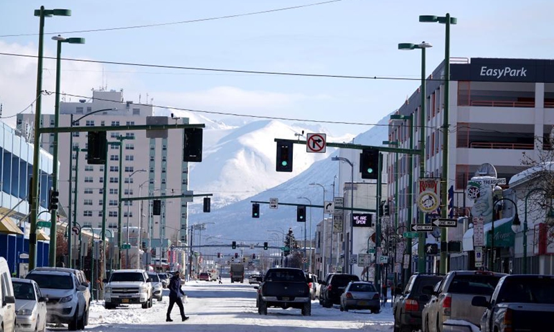 A man walks on the street in Anchorage, Alaska, the United States, March 17, 2021.Photo:Xinhua