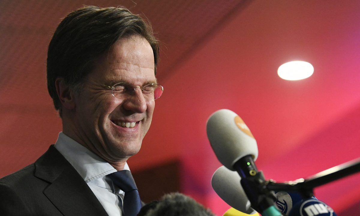 Reelected Dutch Prime Minister Mark Rutte reacts to the exit polls of the House of Representatives' elections in The Hague on Wednesday. Photo: AFP